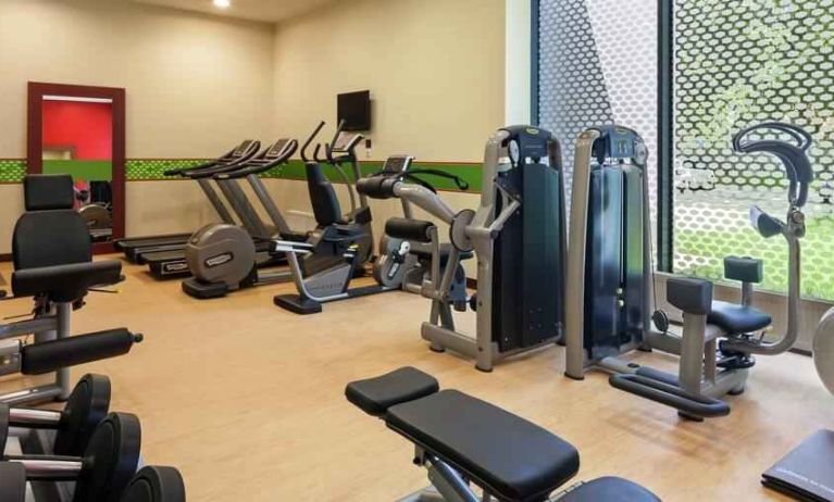 Fully equipped fitness center at the Hampton by Hilton Warsaw Airport.