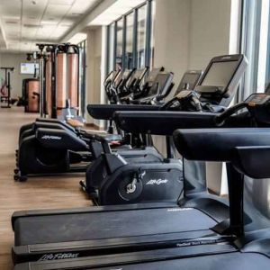 Fitness center with treadmills at the Hampton by Hilton Kalisz.