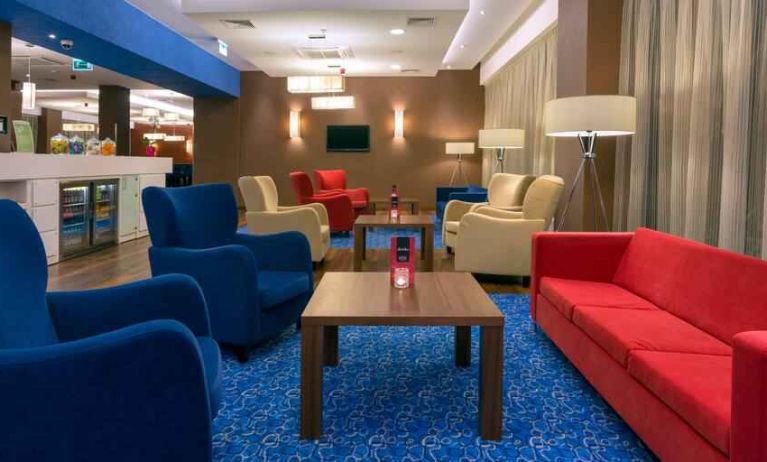 Comfortable lobby workspace at the Hampton by Hilton Gdansk Airport.