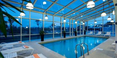 beautiful indoor pool with sunbeds at Adana HiltonSA.