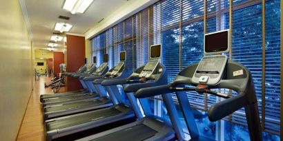 well equipped fitness center with treadmills at Adana HiltonSA.