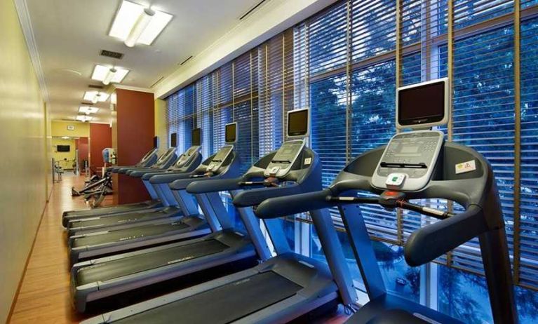 well equipped fitness center with treadmills at Adana HiltonSA.