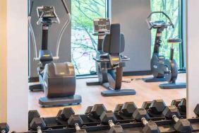 Fitness center with weights and machines at the Hampton by Hilton Warsaw Mokotow.