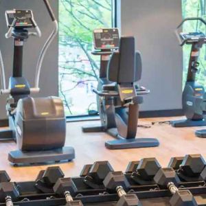 Fitness center with weights and machines at the Hampton by Hilton Warsaw Mokotow.