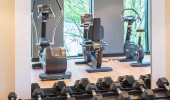 Fitness center with weights and machines at the Hampton by Hilton Warsaw Mokotow.