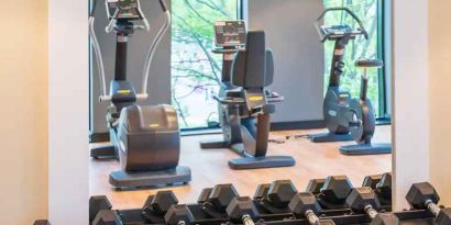 Fitness center with weights and machines at the Hampton by Hilton Warsaw Mokotow.