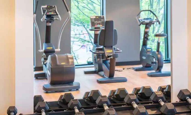 Fitness center with weights and machines at the Hampton by Hilton Warsaw Mokotow.