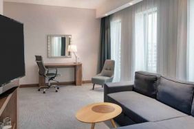 Living room with working station at the Hampton by Hilton Warsaw Mokotow.