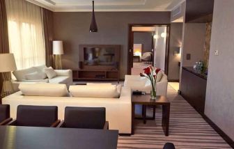 Spacious living room in a hotel suite at the DoubleTree by Hilton Lodz.