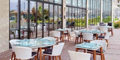 Outdoor seating perfect for co-working at the Hilton Garden Inn Muscat Al Khuwair.