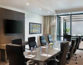 Meeting room with TV screen at the Legend Hotel Lagos Airport, Curio Collection by Hilton.