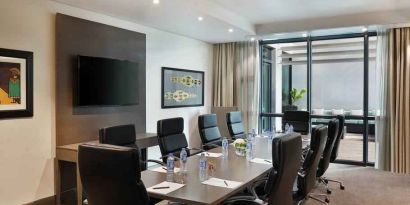 Meeting room with TV screen at the Legend Hotel Lagos Airport, Curio Collection by Hilton.