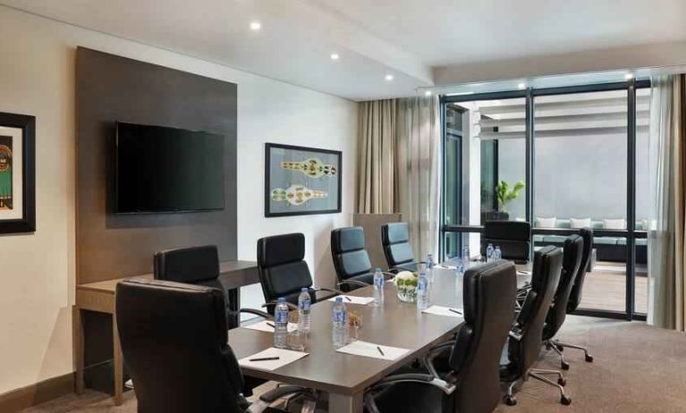 Meeting room with TV screen at the Legend Hotel Lagos Airport, Curio Collection by Hilton.