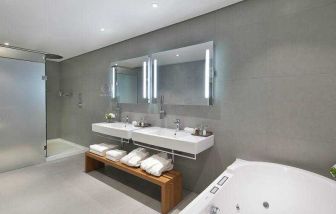 Spacious guest bathroom at the Legend Hotel Lagos Airport, Curio Collection by Hilton.