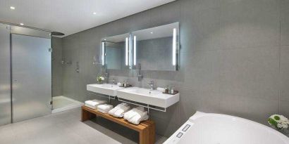 Spacious guest bathroom at the Legend Hotel Lagos Airport, Curio Collection by Hilton.