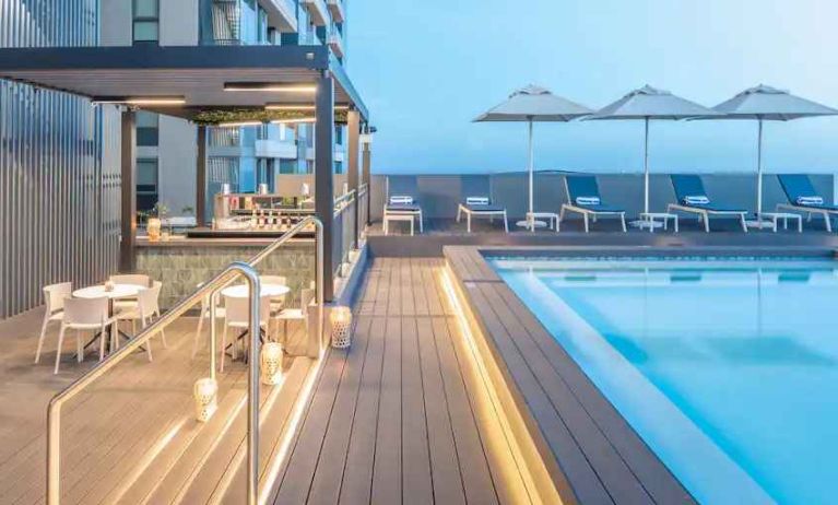 Outdoor pool area with lounges at the Hilton Garden Inn Umhlanga Arch.