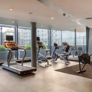 Fitness center with large windows at the Hilton Garden Inn Umhlanga Arch.