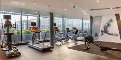 Fitness center with large windows at the Hilton Garden Inn Umhlanga Arch.