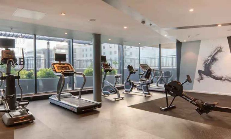 Fitness center with large windows at the Hilton Garden Inn Umhlanga Arch.