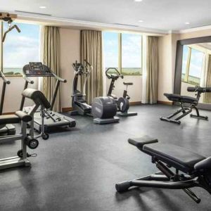 Bright fitness center with windows at the Hilton Garden Inn Al Jubail.