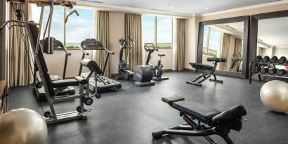 Bright fitness center with windows at the Hilton Garden Inn Al Jubail.