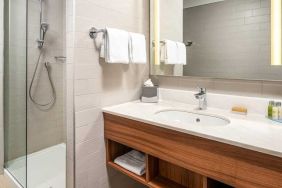 clean and spacious bathroom with shower at Hilton Garden Inn Bucharest Old Town.