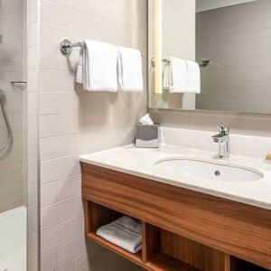 clean and spacious bathroom with shower at Hilton Garden Inn Bucharest Old Town.