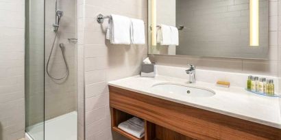 clean and spacious bathroom with shower at Hilton Garden Inn Bucharest Old Town.