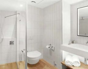 clean and spacious bathroom with shower at Hilton Garden Inn Bucharest Airport.