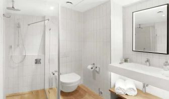 clean and spacious bathroom with shower at Hilton Garden Inn Bucharest Airport.