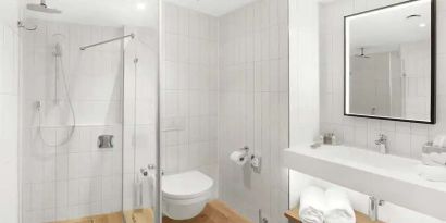 clean and spacious bathroom with shower at Hilton Garden Inn Bucharest Airport.