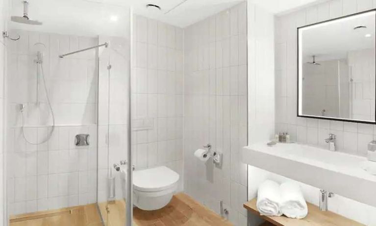 clean and spacious bathroom with shower at Hilton Garden Inn Bucharest Airport.