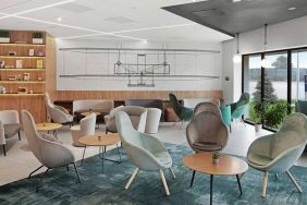 comfortable lobby and coworking space at Hilton Garden Inn Bucharest Airport.