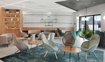 comfortable lobby and coworking space at Hilton Garden Inn Bucharest Airport.