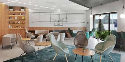 comfortable lobby and coworking space at Hilton Garden Inn Bucharest Airport.