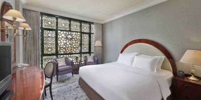 King bedroom with desk at the Madinah Hilton Hotel.