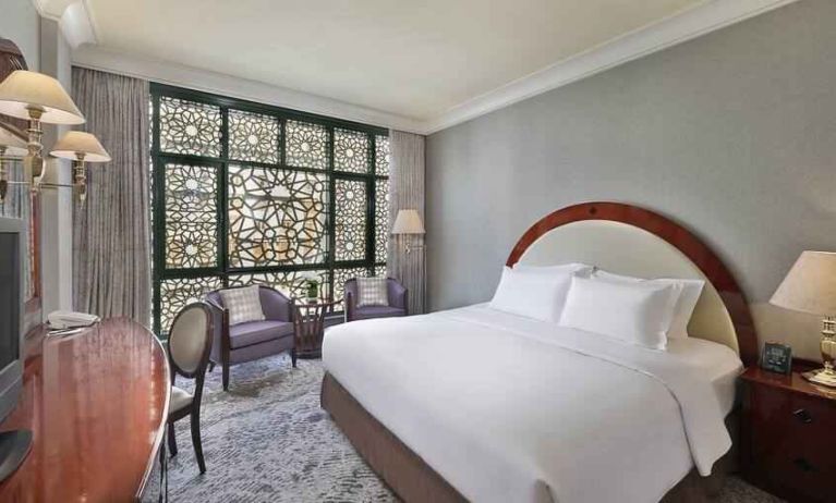 King bedroom with desk at the Madinah Hilton Hotel.