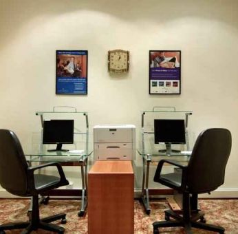 Business center with computers and printer at the Madinah Hilton Hotel.