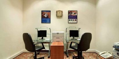 Business center with computers and printer at the Madinah Hilton Hotel.