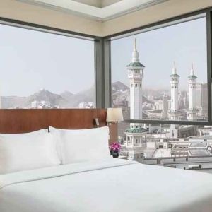 Hotel room with large windows and view at the Hilton Suites Makkah.