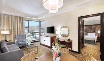 Living room with working station at the Hilton Suites Makkah.