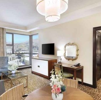 Living room with working station at the Hilton Suites Makkah.