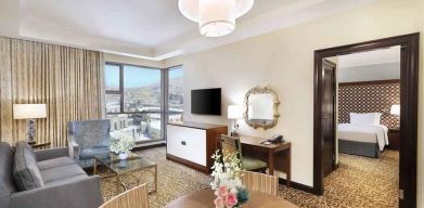 Living room with working station at the Hilton Suites Makkah.