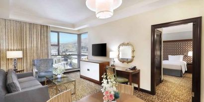 Living room with working station at the Hilton Suites Makkah.