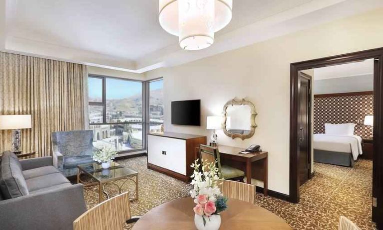 Living room with working station at the Hilton Suites Makkah.