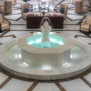 Lobby workspace with fountain at the Hilton Suites Makkah.