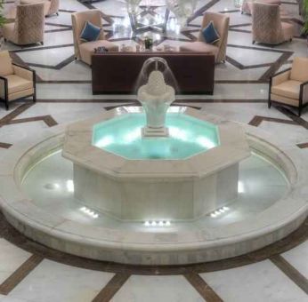 Lobby workspace with fountain at the Hilton Suites Makkah.