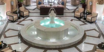 Lobby workspace with fountain at the Hilton Suites Makkah.