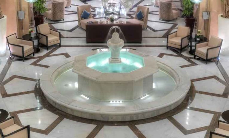 Lobby workspace with fountain at the Hilton Suites Makkah.