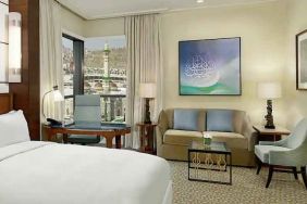 King bedroom with desk and sofa at the Conrad Makkah.